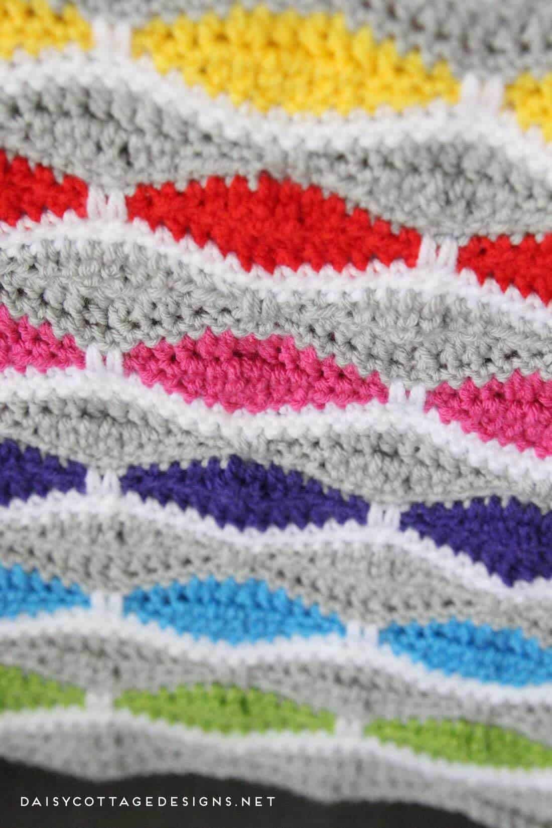 crochet blanket pattern | free crochet patterns | crochet afghan pattern | modern crochet pattern | Use this free crochet pattern from Daisy Cottage Designs to create this bright and fun afghan. Whether you're making a baby blanket for a friend or you just want a something to drape over your favorite chair, you'll love this crochet pattern. Instructions given to make this blanket in any size. 
