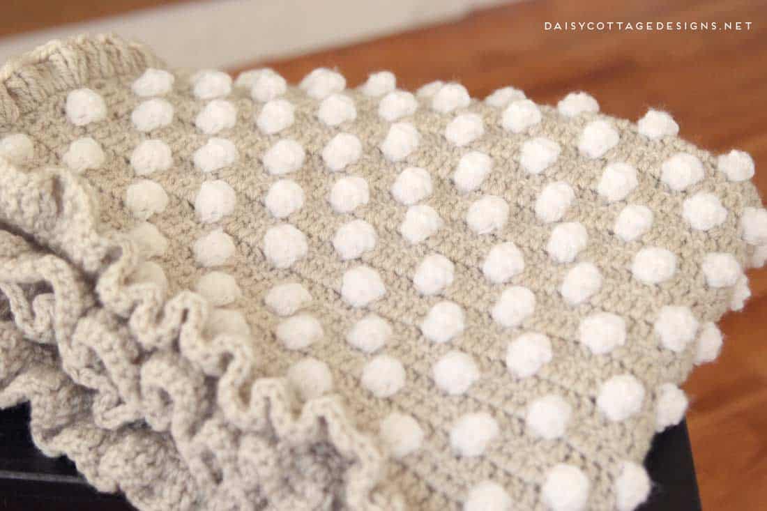 free crochet pattern | crochet blanket pattern | crochet baby blanket | polkadot blanket | Daisy Cottage Designs | Use this free crochet baby blanket pattern to make an adorable baby shower gift. Or, make a larger size and throw it over your couch, chair, or bed. It's a beautiful pattern with detailed instructions and a video tutorial. 