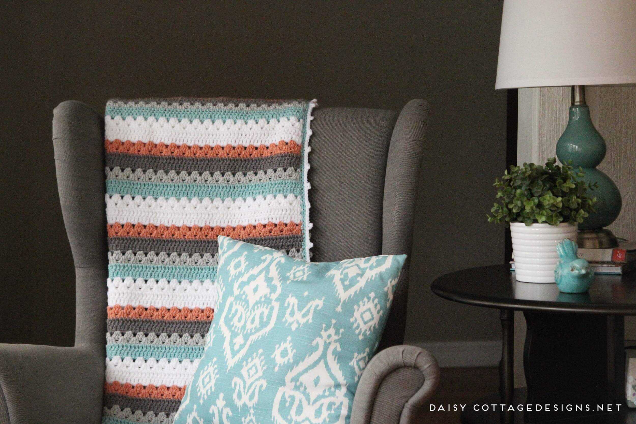 Use this blanket crochet pattern from Daisy Cottage Designs to create a beautiful afghan in any color way. | free crochet pattern, easy crochet pattern, free blanket crochet pattern, granny stripe crochet pattern