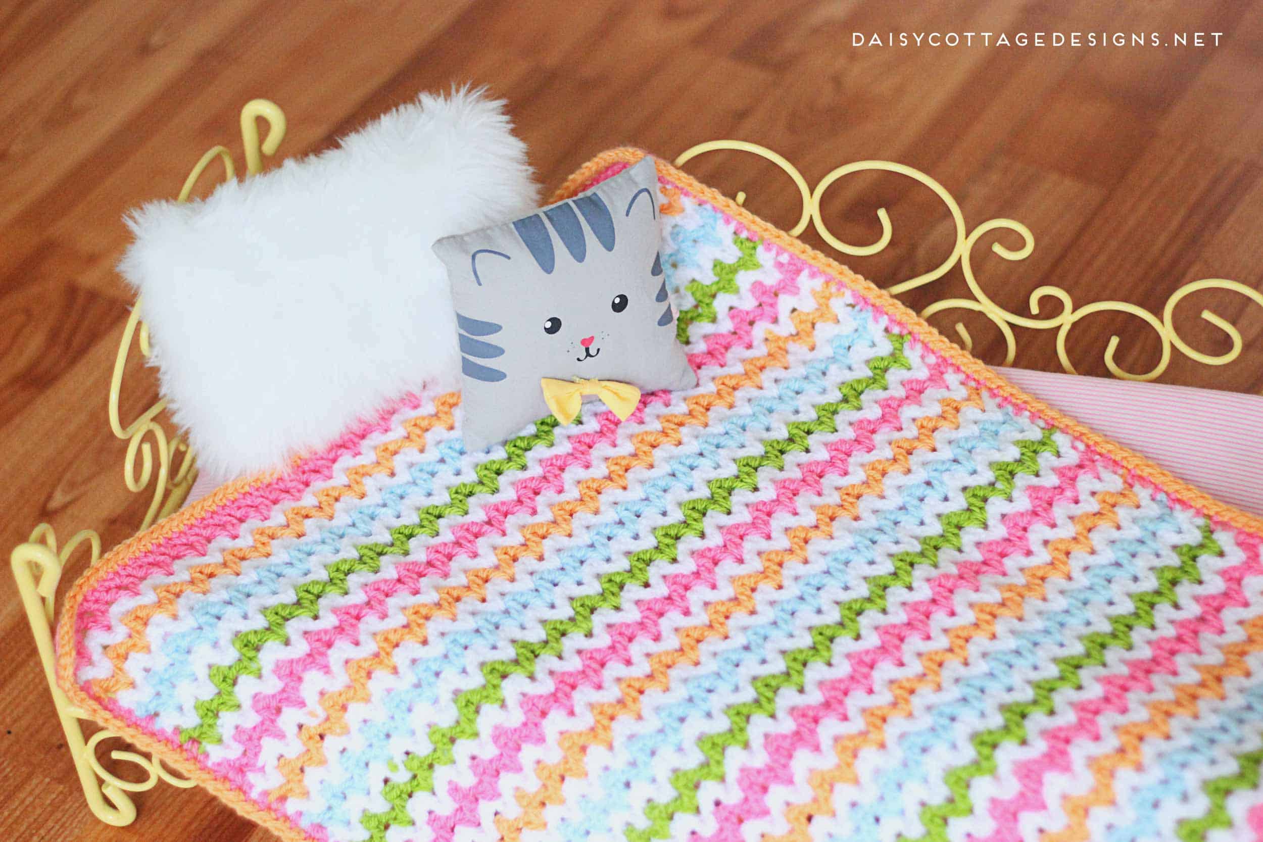 Use this adorable v stitch crochet pattern to create this crochet baby blanket in any size you wish. Free crochet pattern from Daisy Cottage Designs. | baby blanket crochet pattern, easy crochet patter, free crochet pattern, rainbow blanket crochet pattern 