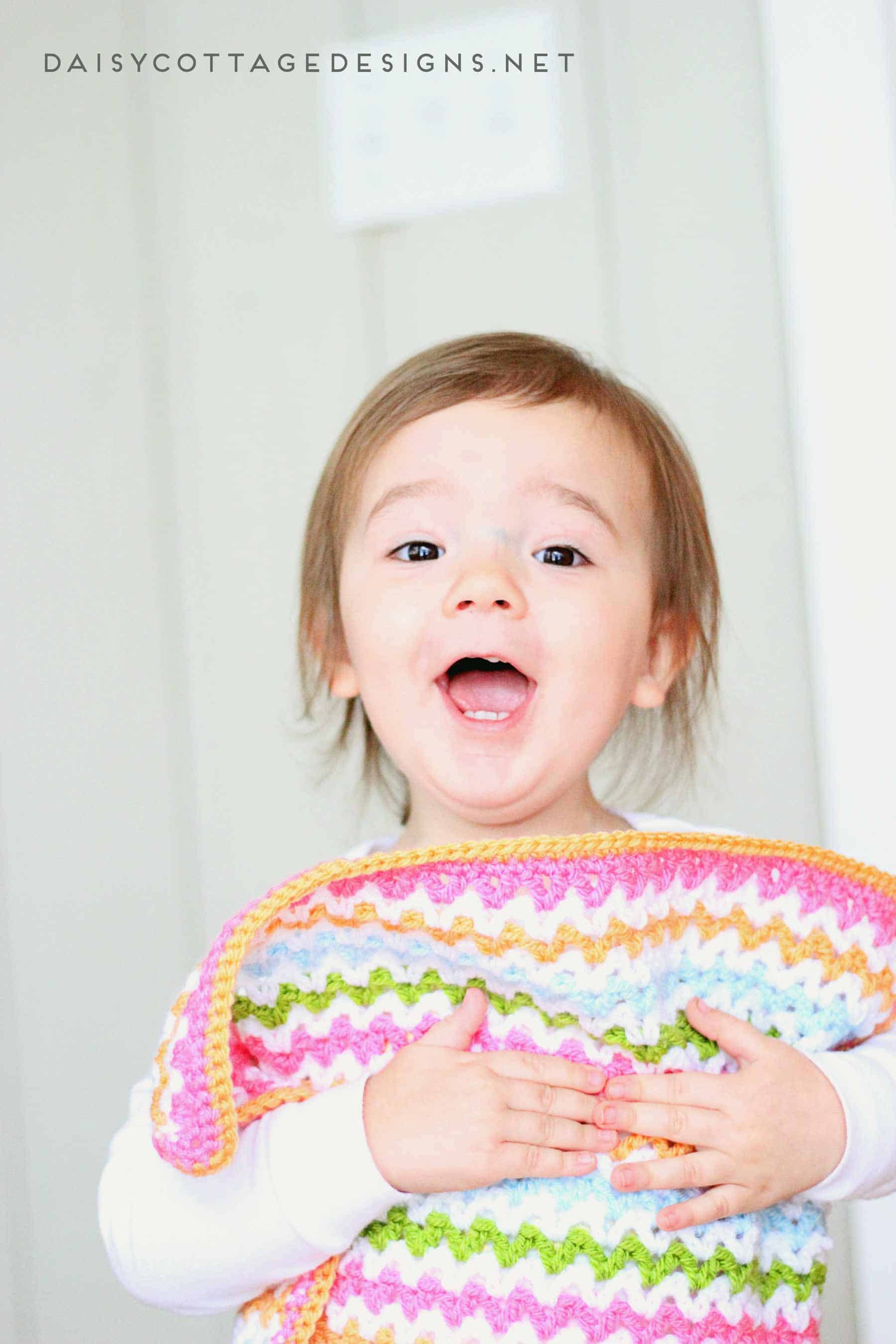 Use this adorable v stitch crochet pattern to create this crochet baby blanket in any size you wish. Free crochet pattern from Daisy Cottage Designs. | baby blanket crochet pattern, easy crochet patter, free crochet pattern, rainbow blanket crochet pattern 