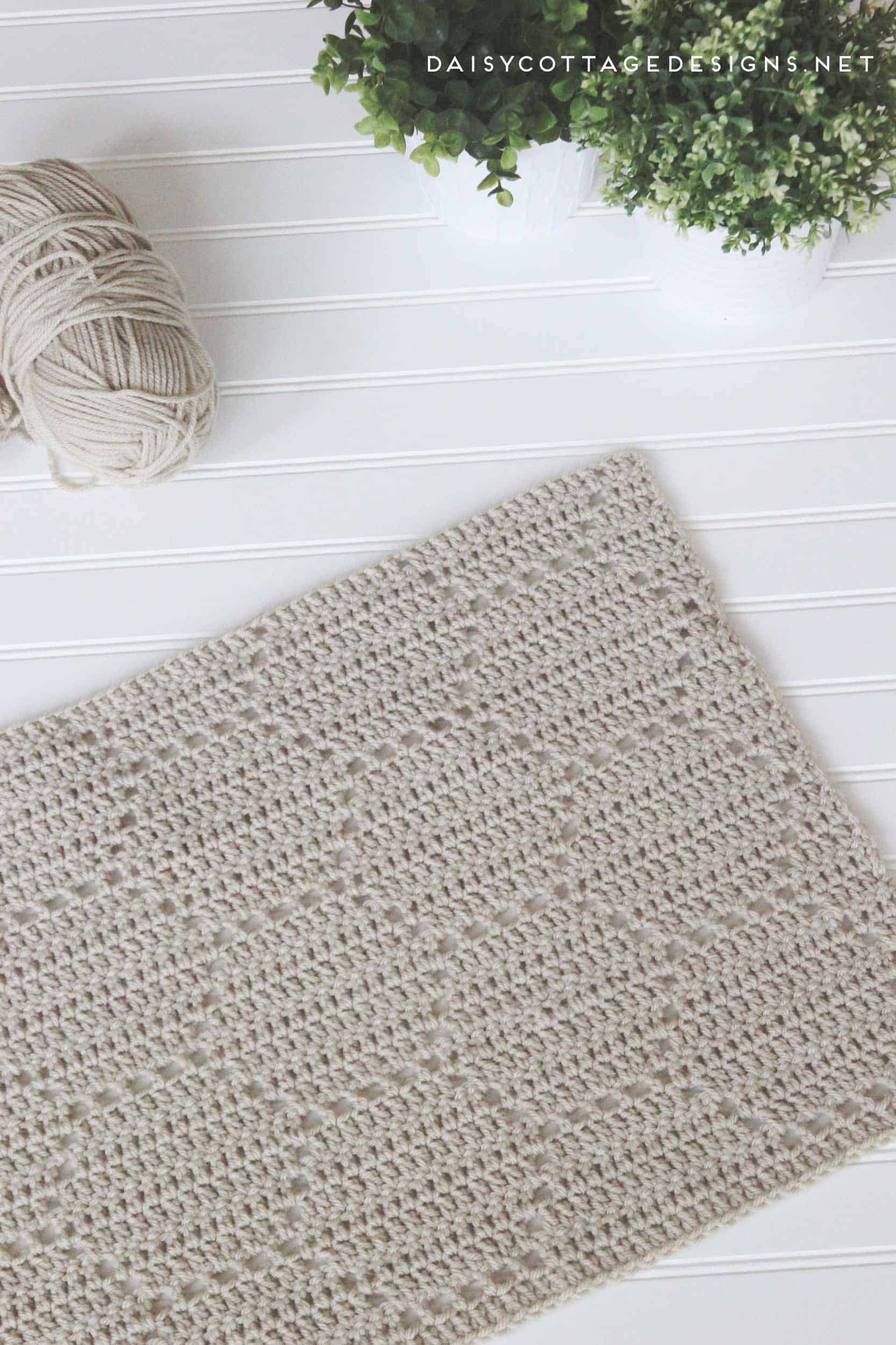 Use this filet crochet pattern to create a beautiful honeycomb blanket. This easy crochet pattern works up quickly and yields gorgeous results. 