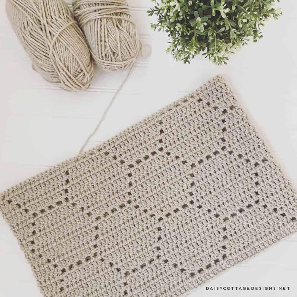 Use this filet crochet pattern to create a beautiful honeycomb blanket. This easy crochet pattern works up quickly and yields gorgeous results. 