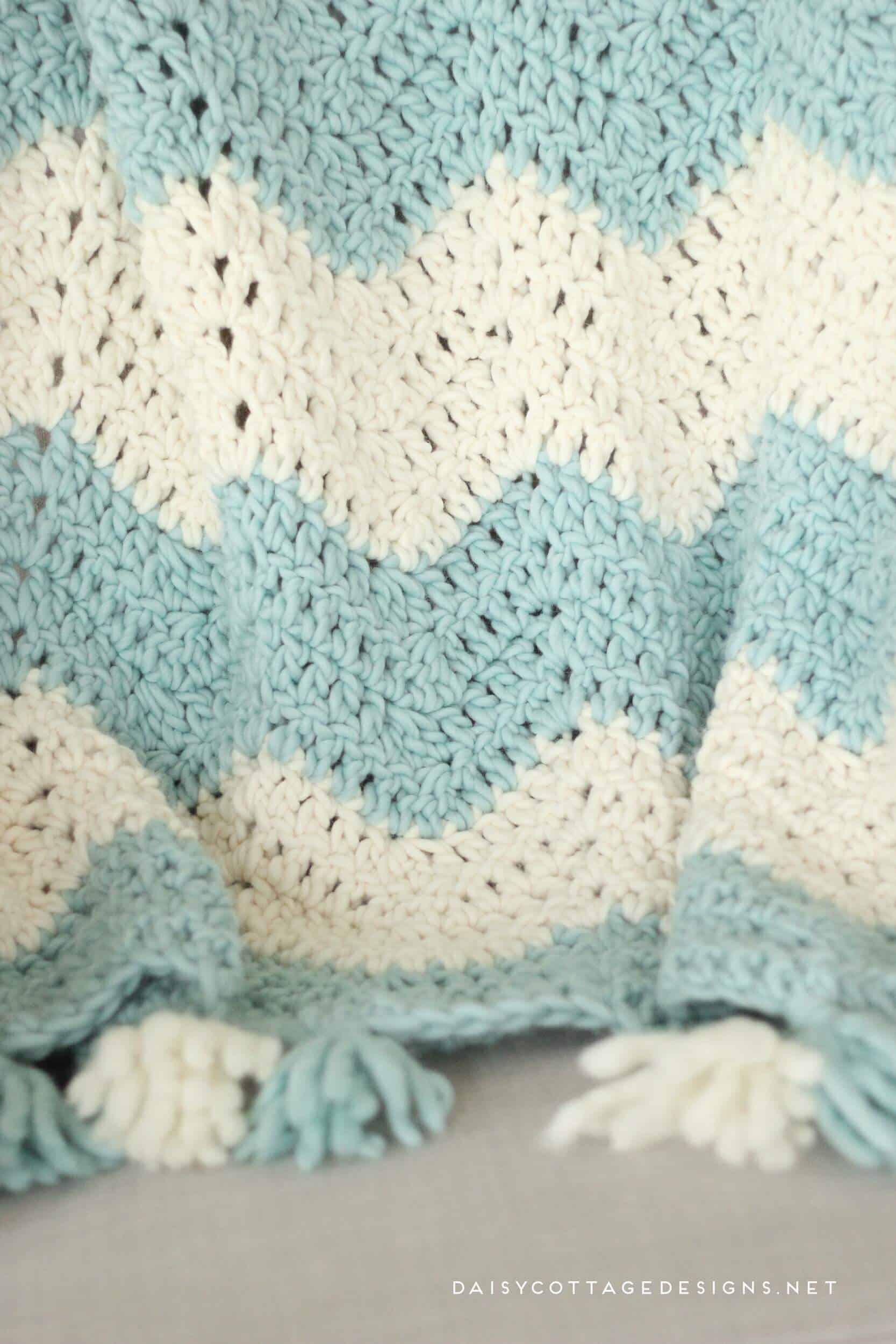 Chunky Chevron Crochet Blanket with Tassels. Beautiful and easy to make. Get a discount on this beautiful Yarn, too! | chunky chevron blanket, quick crochet blanket, bulky yarn patterns, Daisy Cottage Designs