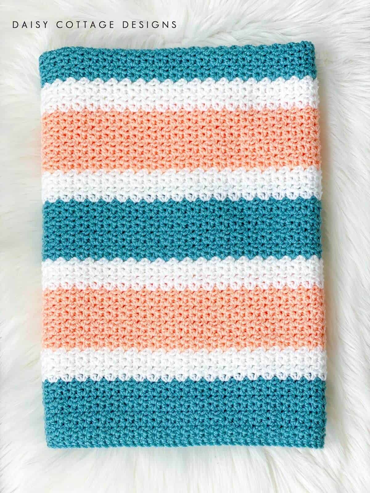 V Stitch Crochet at its finest! Learn how to create this gorgeous crochet blanket using use this quick and easy free crochet pattern.