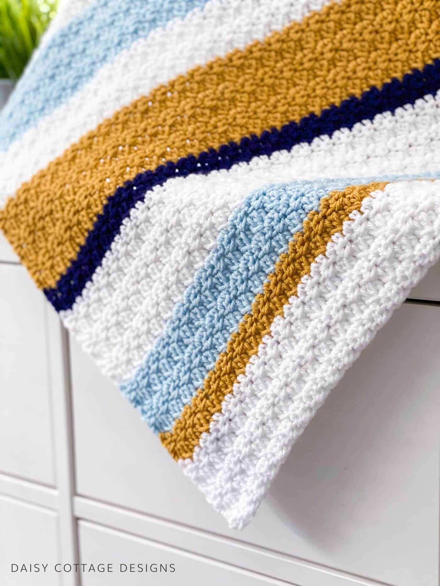 Textured crochet blanket and dresser