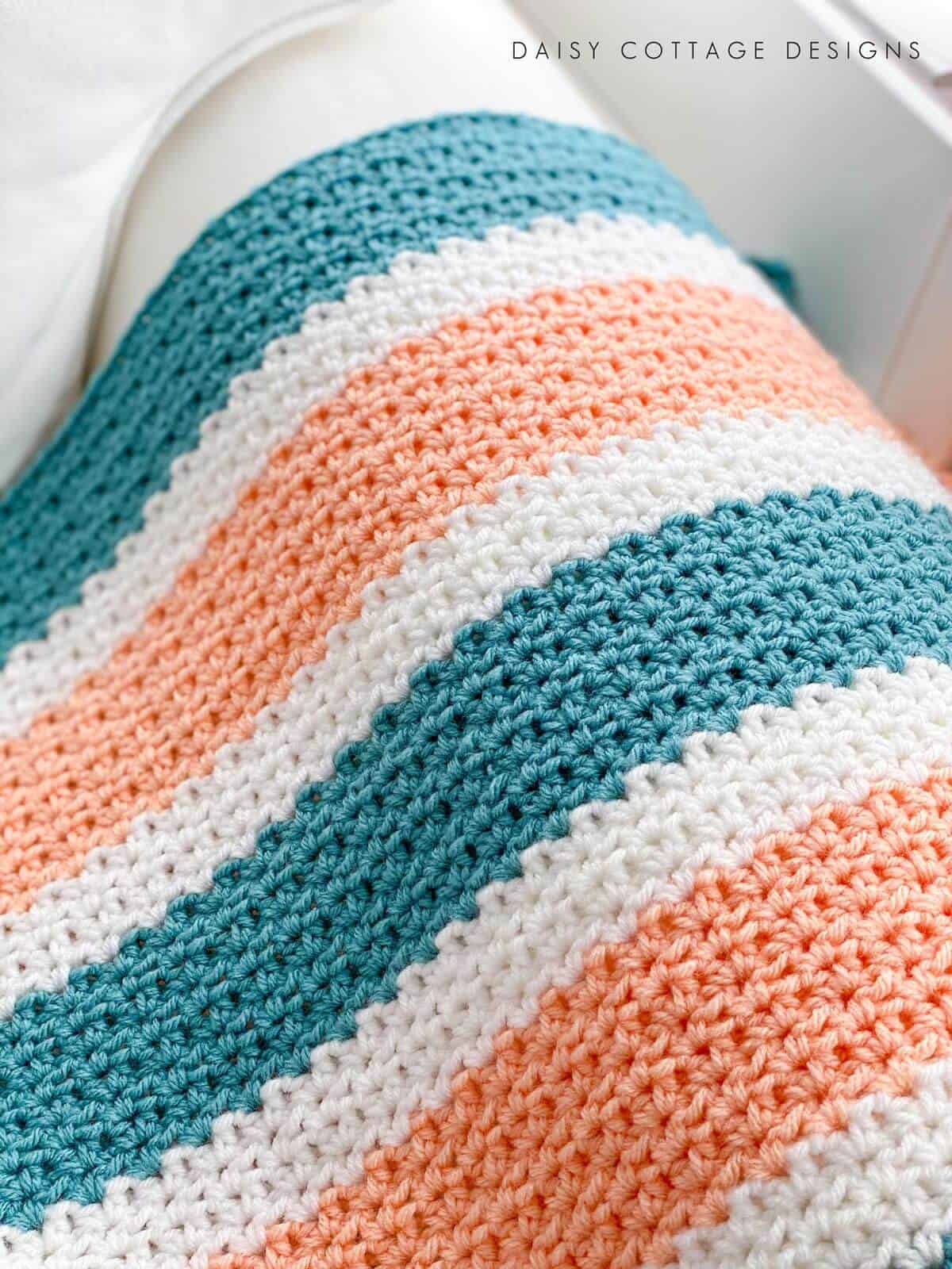 V Stitch Crochet at its finest! Learn how to create this gorgeous crochet blanket using use this quick and easy free crochet pattern.