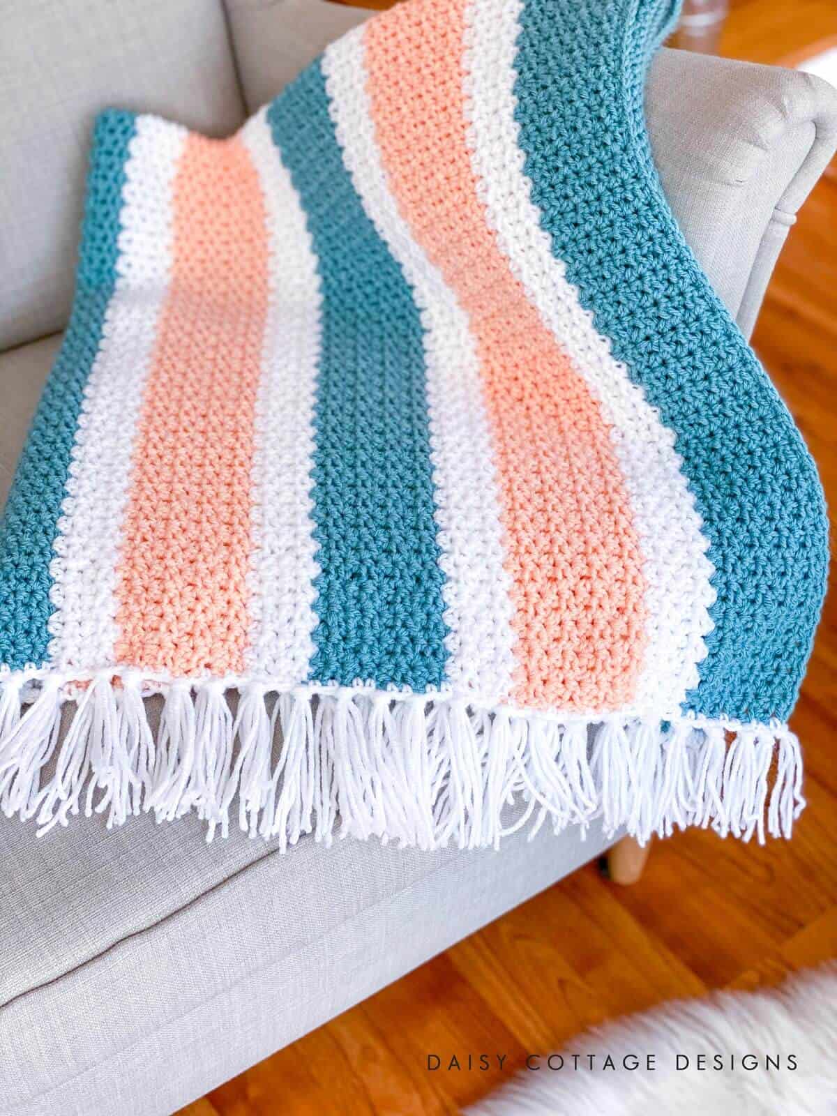 V Stitch Crochet at its finest! Learn how to create this gorgeous crochet blanket using use this quick and easy free crochet pattern.