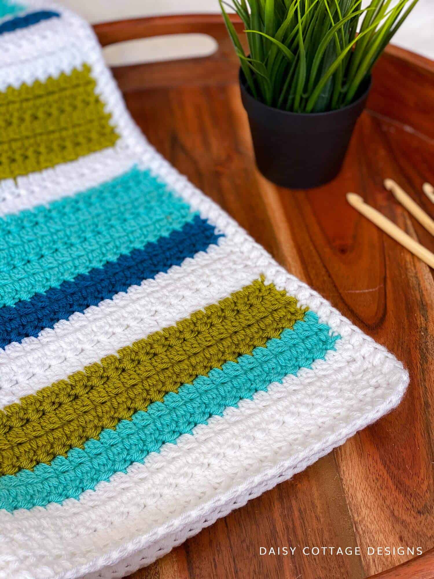 This blanket pattern features a beautiful, textured crochet stitch that's easy to make and yields stunning results. 