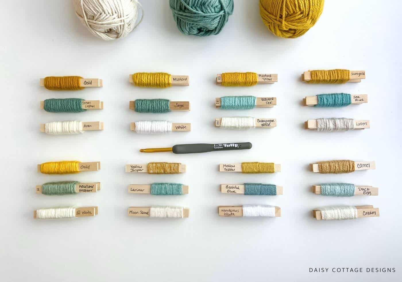 Yarn Pegs in various shades of mustard, teal, and white.