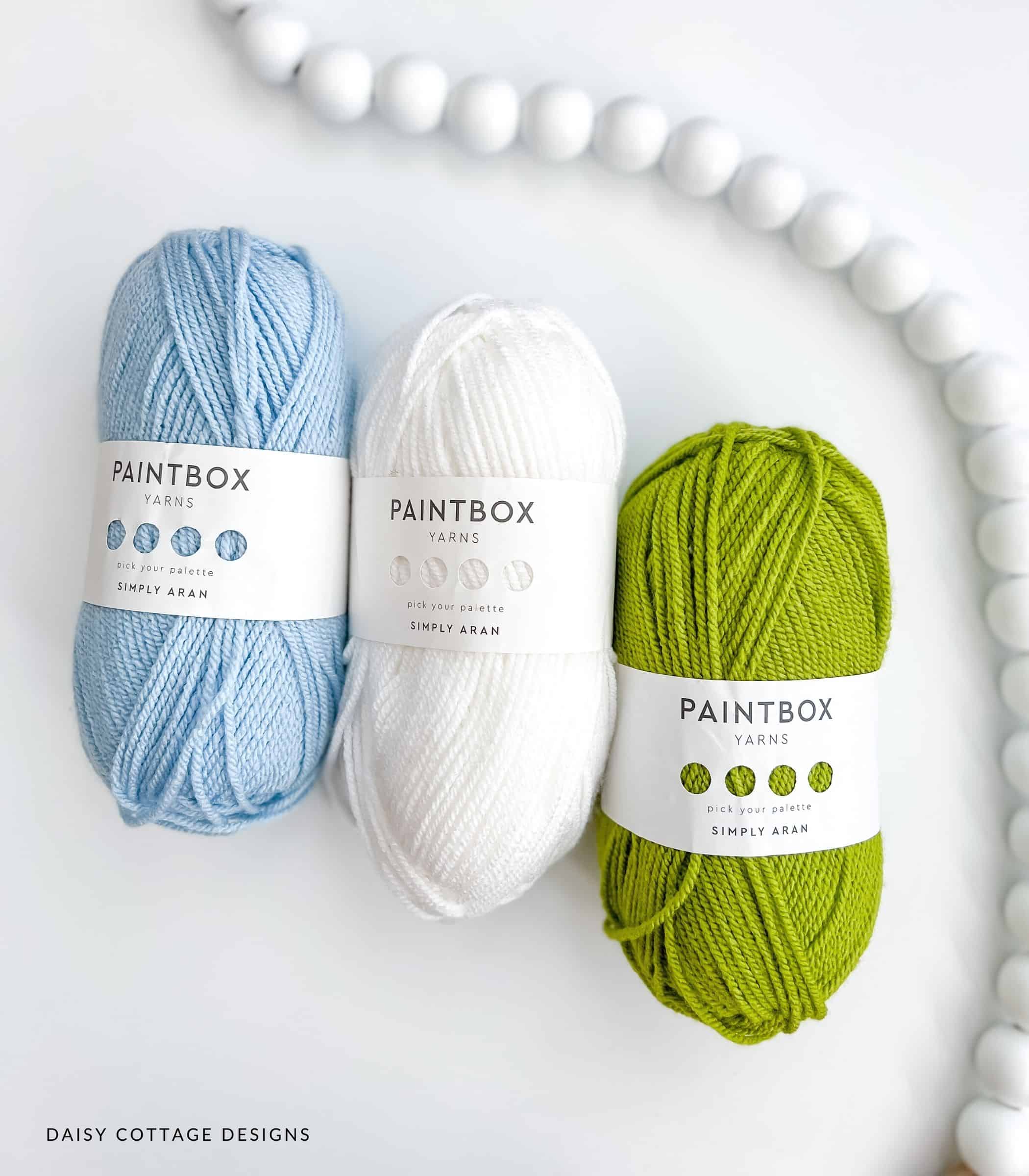 Blue, white, and green yarn