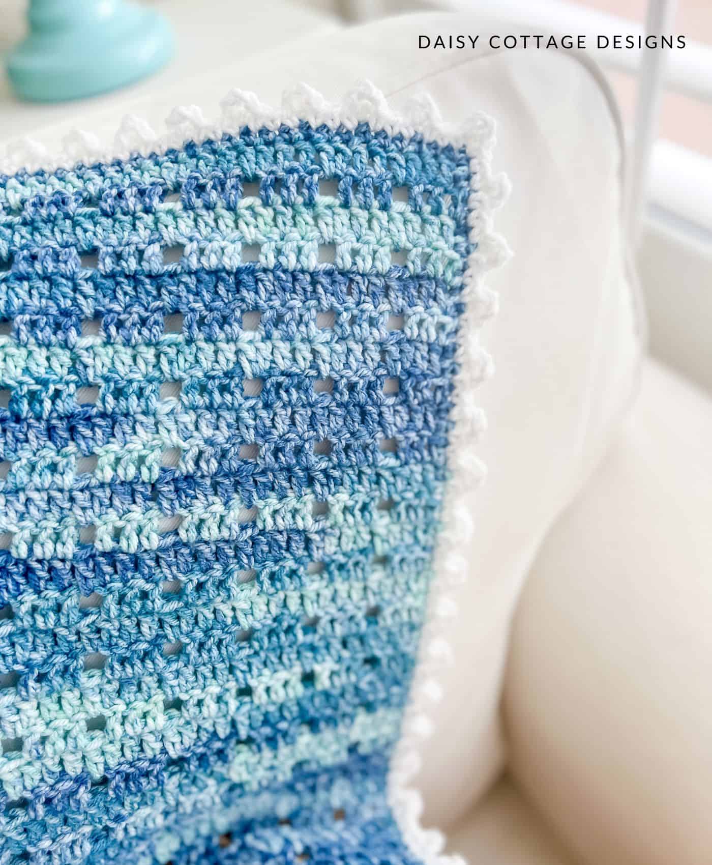 Double crochet blanket with white picot border