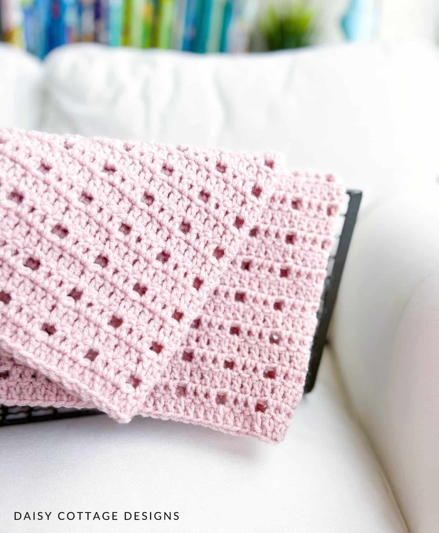 simple crochet blanket over metal basket