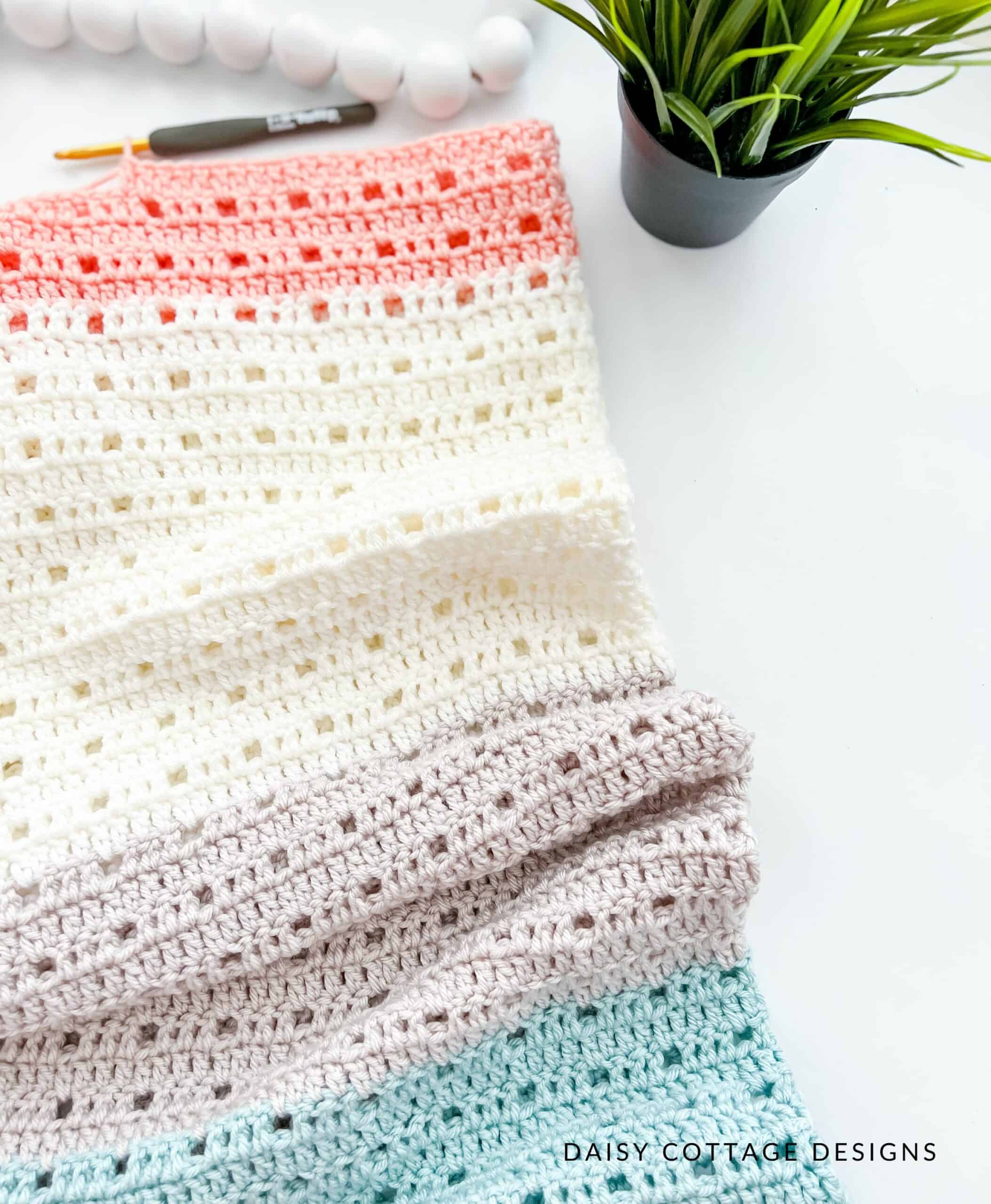 colorful crochet blanket on a white background