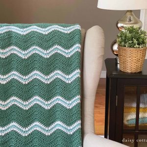 Use this free ripple crochet pattern from Daisy Cottage Designs to create a blanket in any size. Perfect for baby blankets, throw blankets, and more. It's an easy crochet pattern that works up quickly!